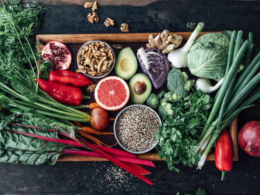 Collection Of Raw Food, Fruits And Vegetables On A Tablet Collection Of Raw Food, Fruits And Vegetables On A Tablet